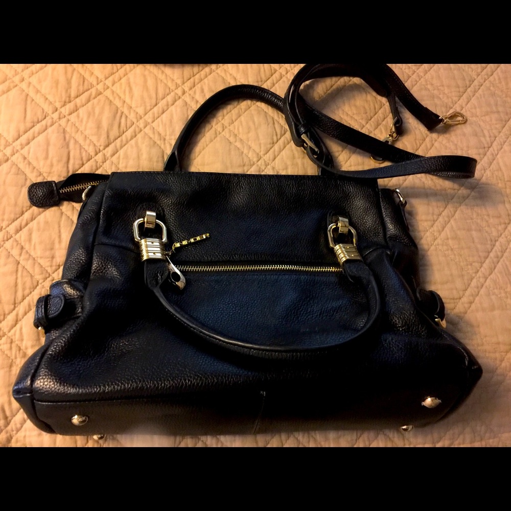 Large crossbody bag with gold tone accents.